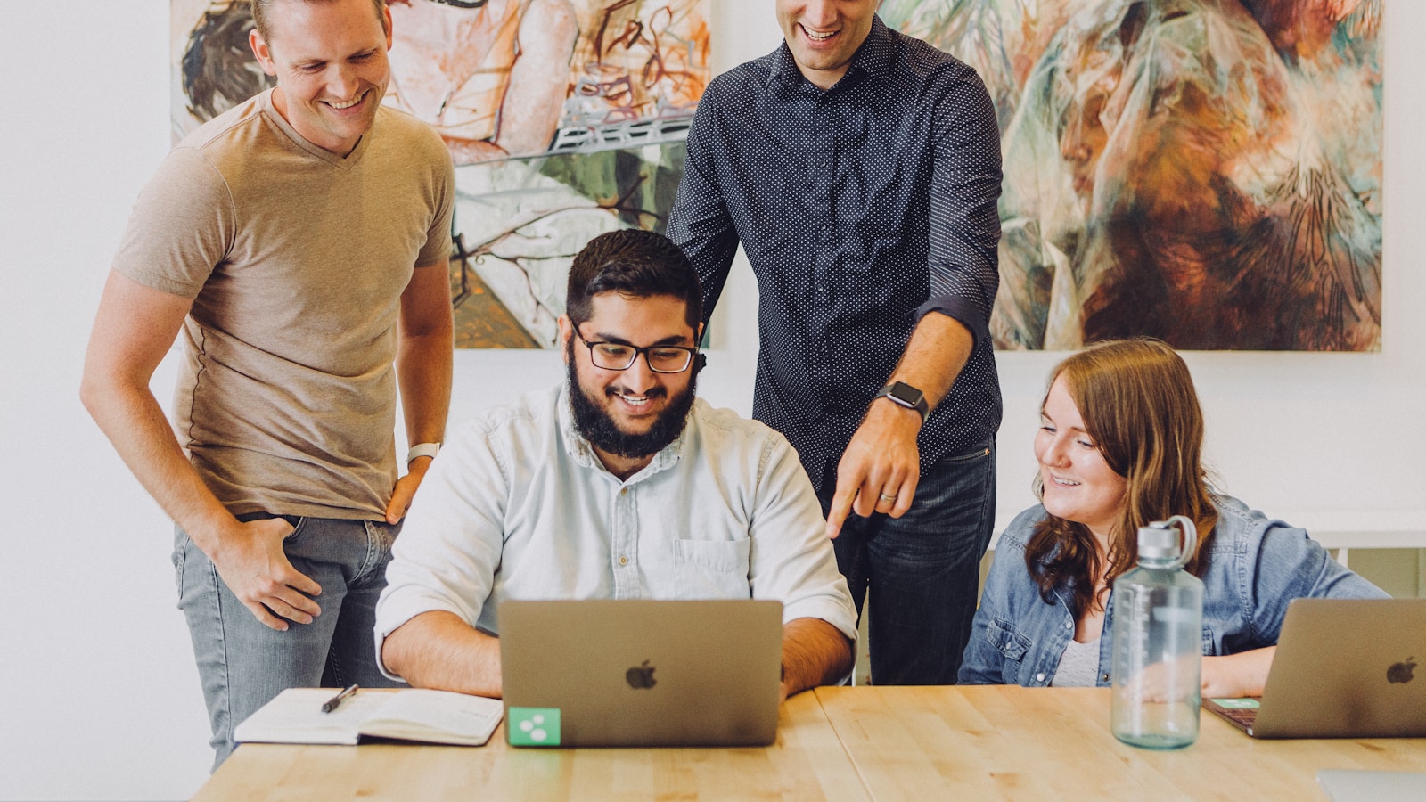 A business team reviewing work together