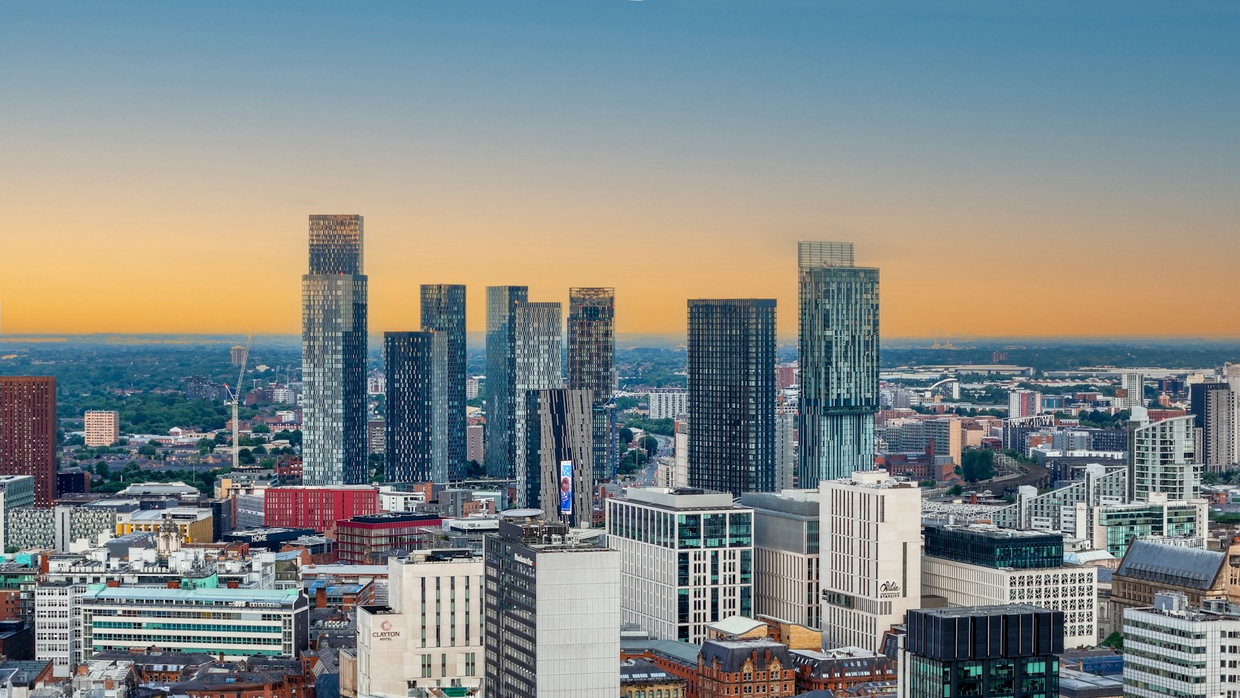 Manchester city skyline photographed at sunset for the AI agency service area page
