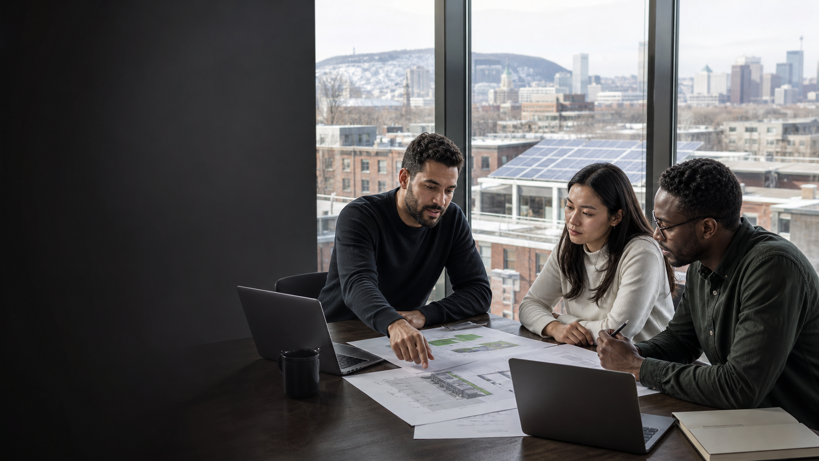 Montreal renewable-energy professionals reviewing a building decarbonization and storage project