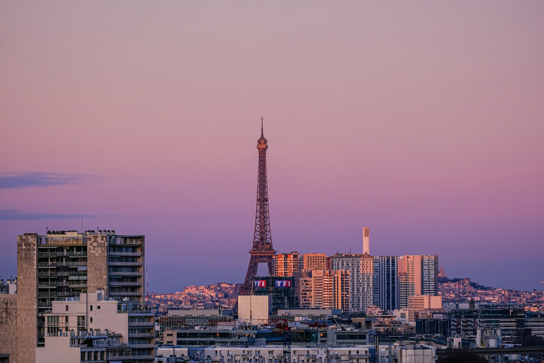 Paris skyline with the Eiffel Tower photographed at dusk
