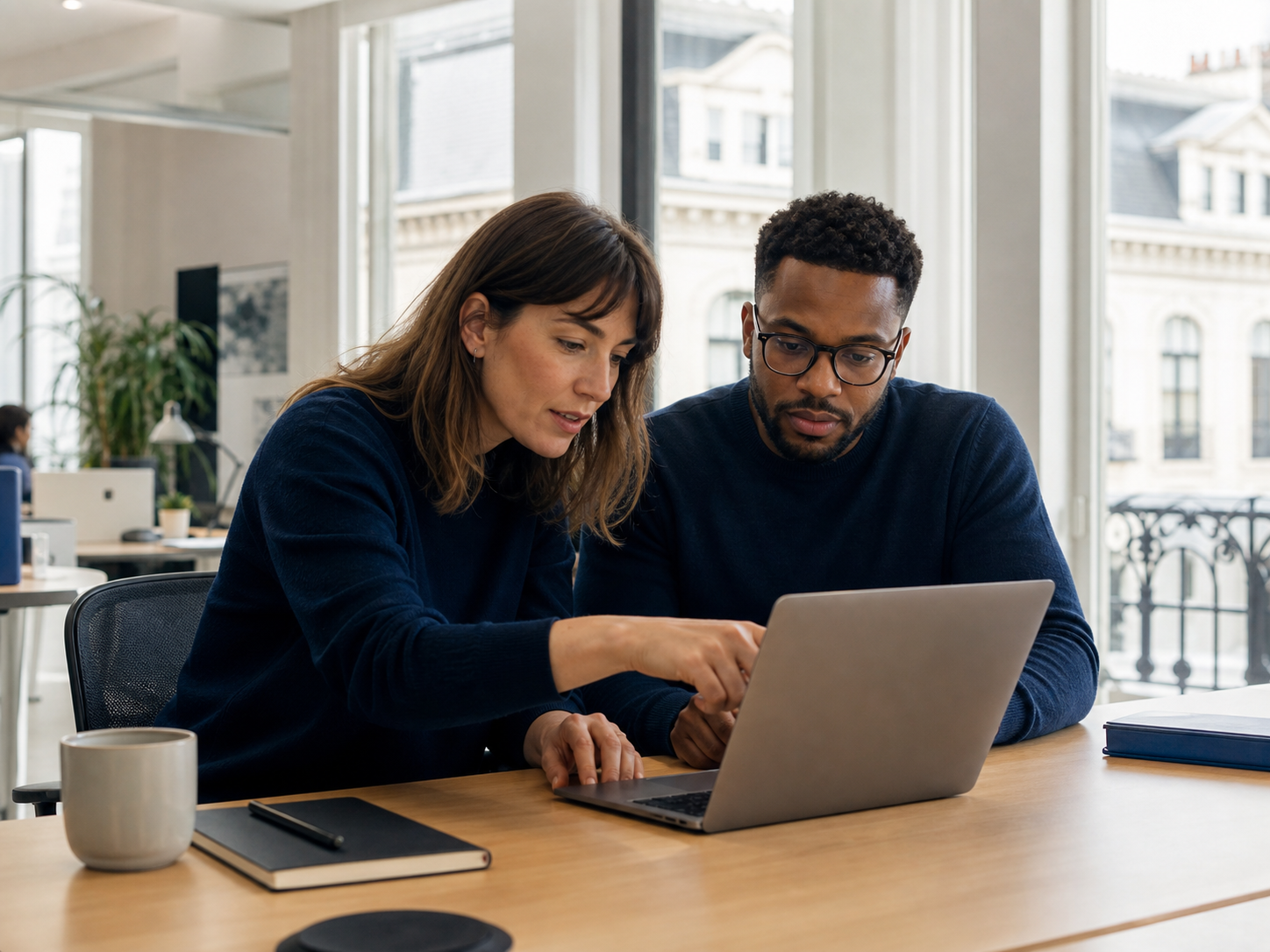 Paris colleagues working through a managed IT and laptop support issue
