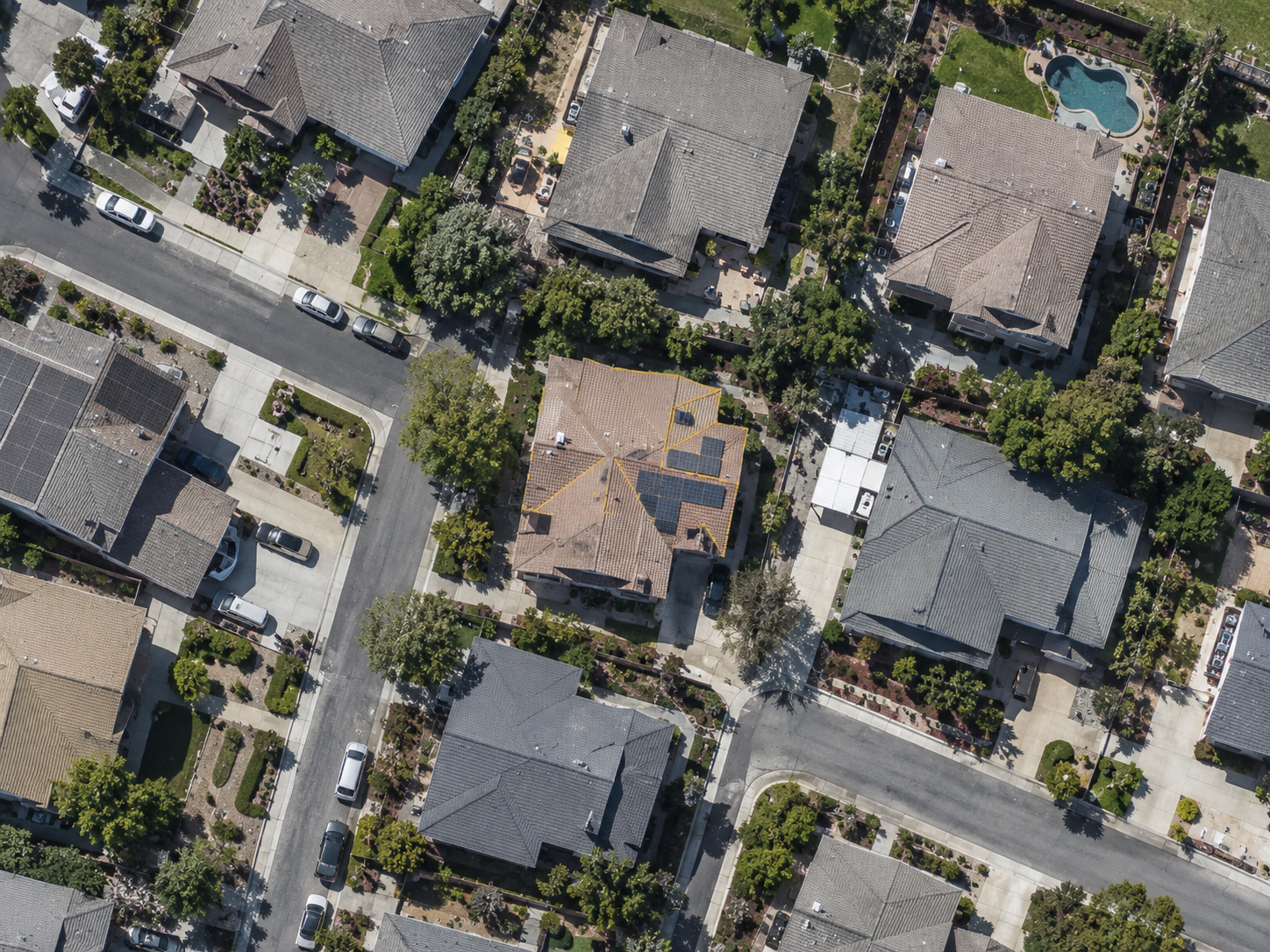Aerial roof selection with an outline and suggested solar panel area